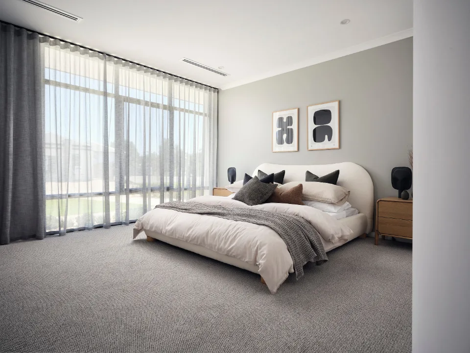 Modern bedroom with cozy bedding, large window, elegant decor, and neutral tones.