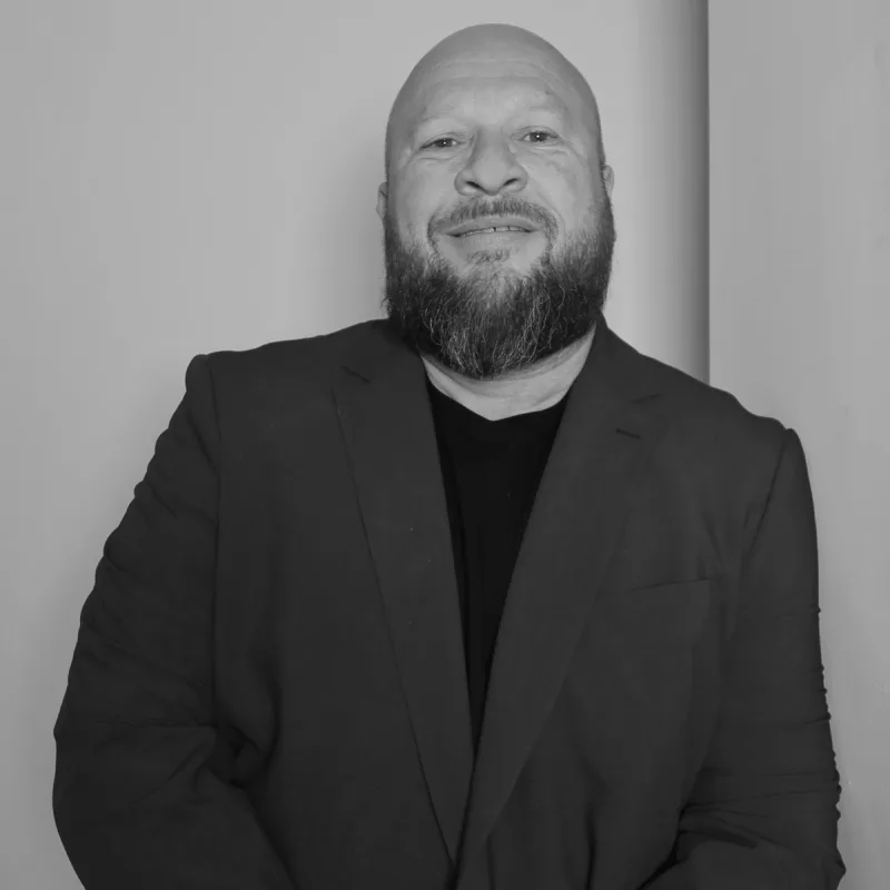 David Hochwald-Jones, Executive General Manager. A professional black and white headshot in a suit jacket.