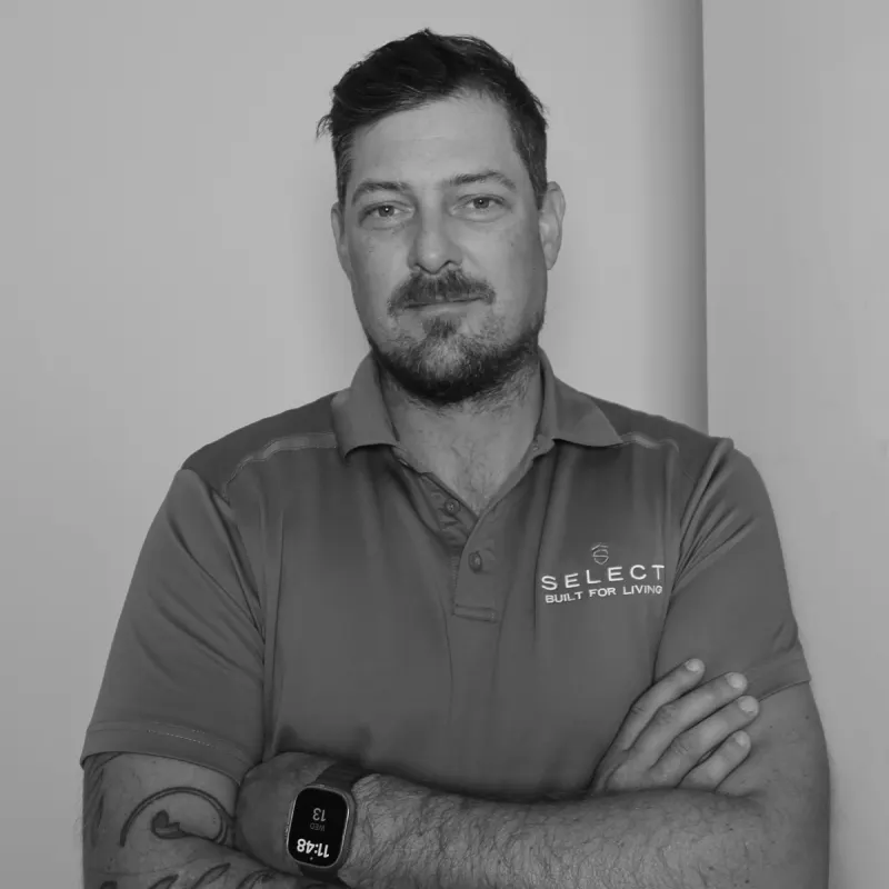 Kurt H, Site Manager. Professional black and white headshot, with a beard, in a branded polo shirt.