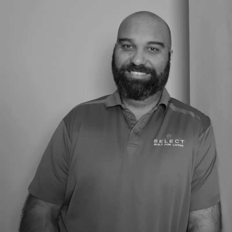 Richard B, Construction Manager North. Professional black and white headshot, with a beard, in a branded polo shirt.